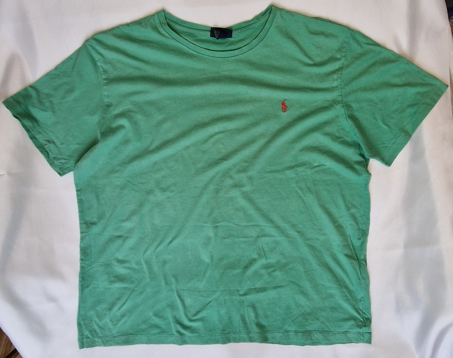A green short-sleeved cotton t-shirt by Polo Ralph Lauren with a red embroidered logo.