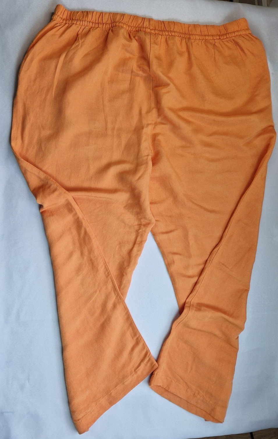 H&M women's orange wide-leg jogger trousers with an elasticated waistband.