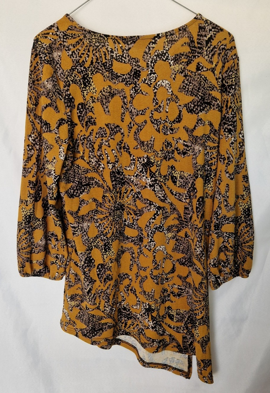 Klass women's yellow long-sleeve tunic top with a round neck and an asymmetric hem.