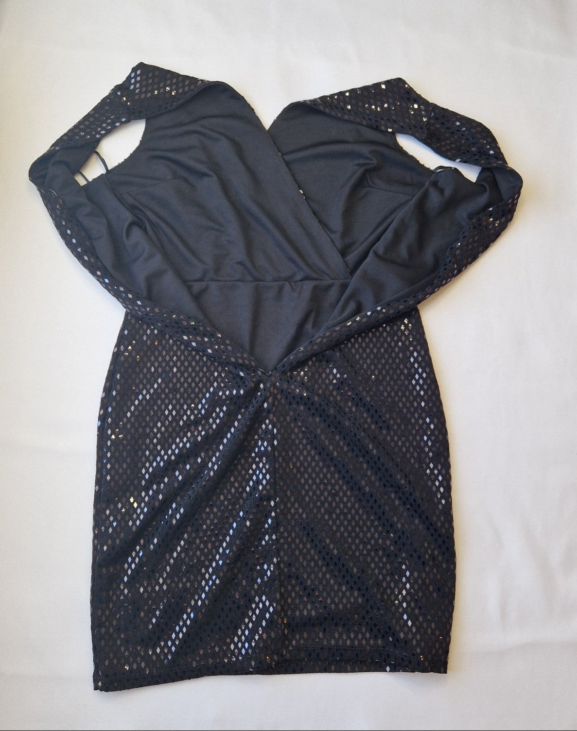 A black one-shoulder bodycon party dress featuring a mesh overlay with sequin embellishments.