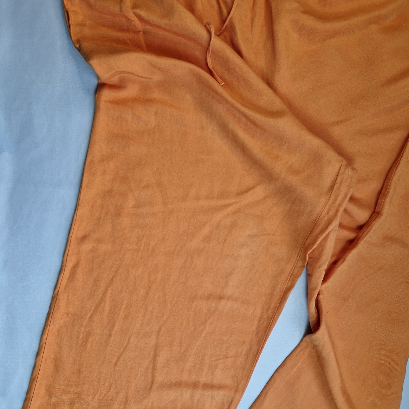 H&M orange wide-leg jogger trousers with an elasticated drawstring waist.