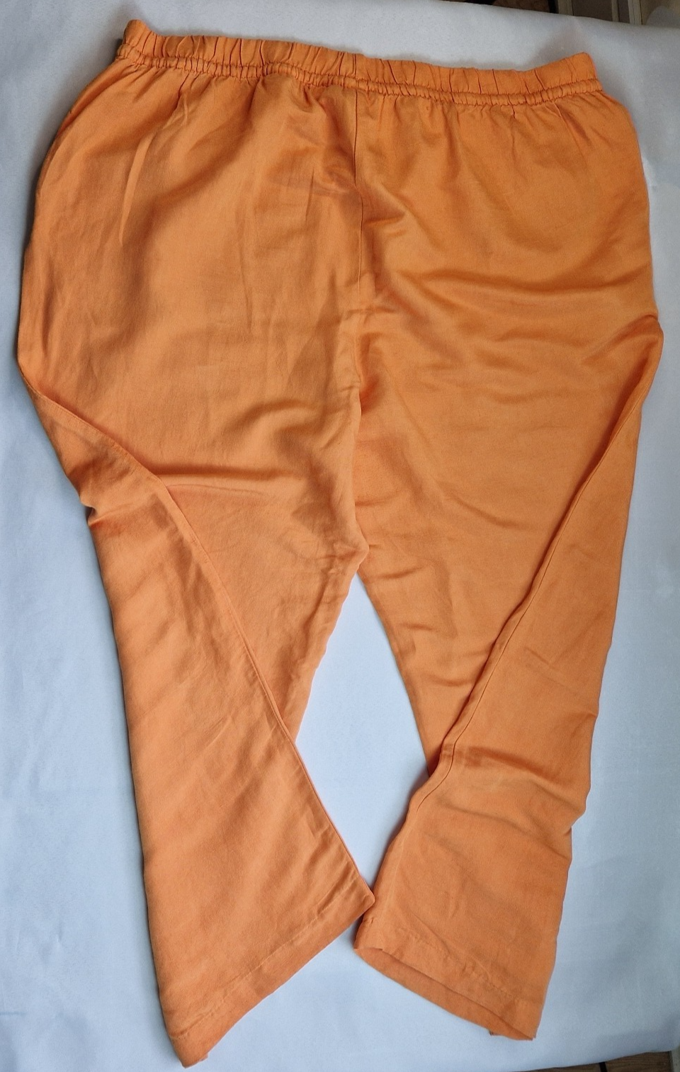 H&M women's orange wide-leg jogger trousers with an elasticated waistband.