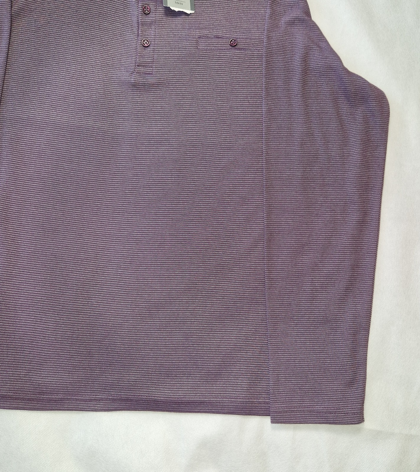 A purple long-sleeved pullover sweatshirt in a soft cotton blend with a buttoned placket.