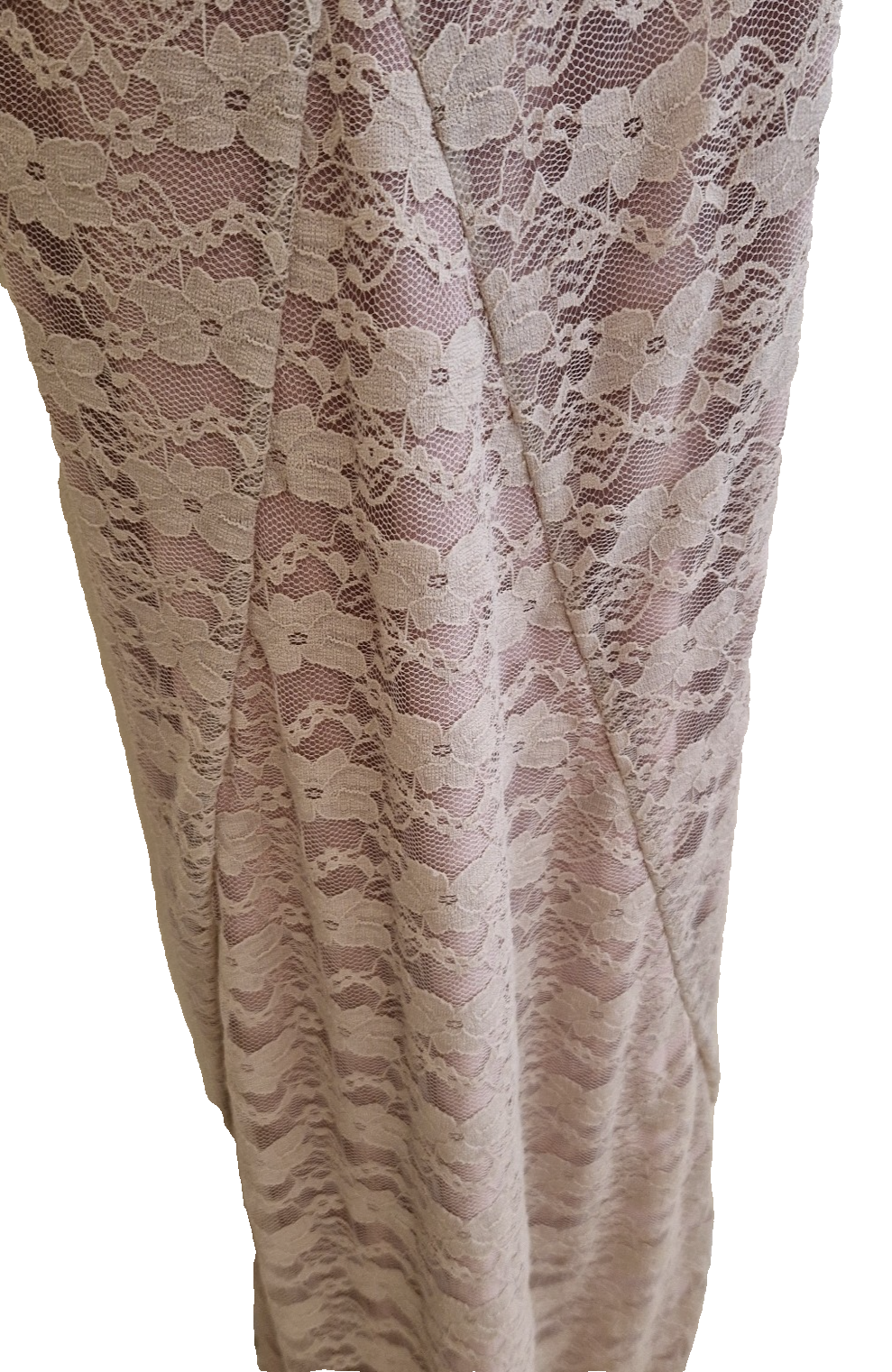A close-up of a pink lace ball gown featuring intricate floral embroidery and structural seams.