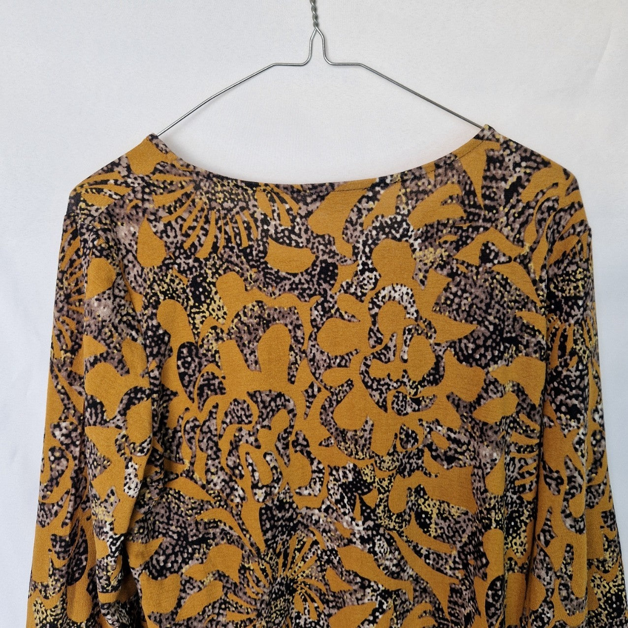 Klass women's long-sleeve tunic top in yellow with a black and grey abstract floral print.