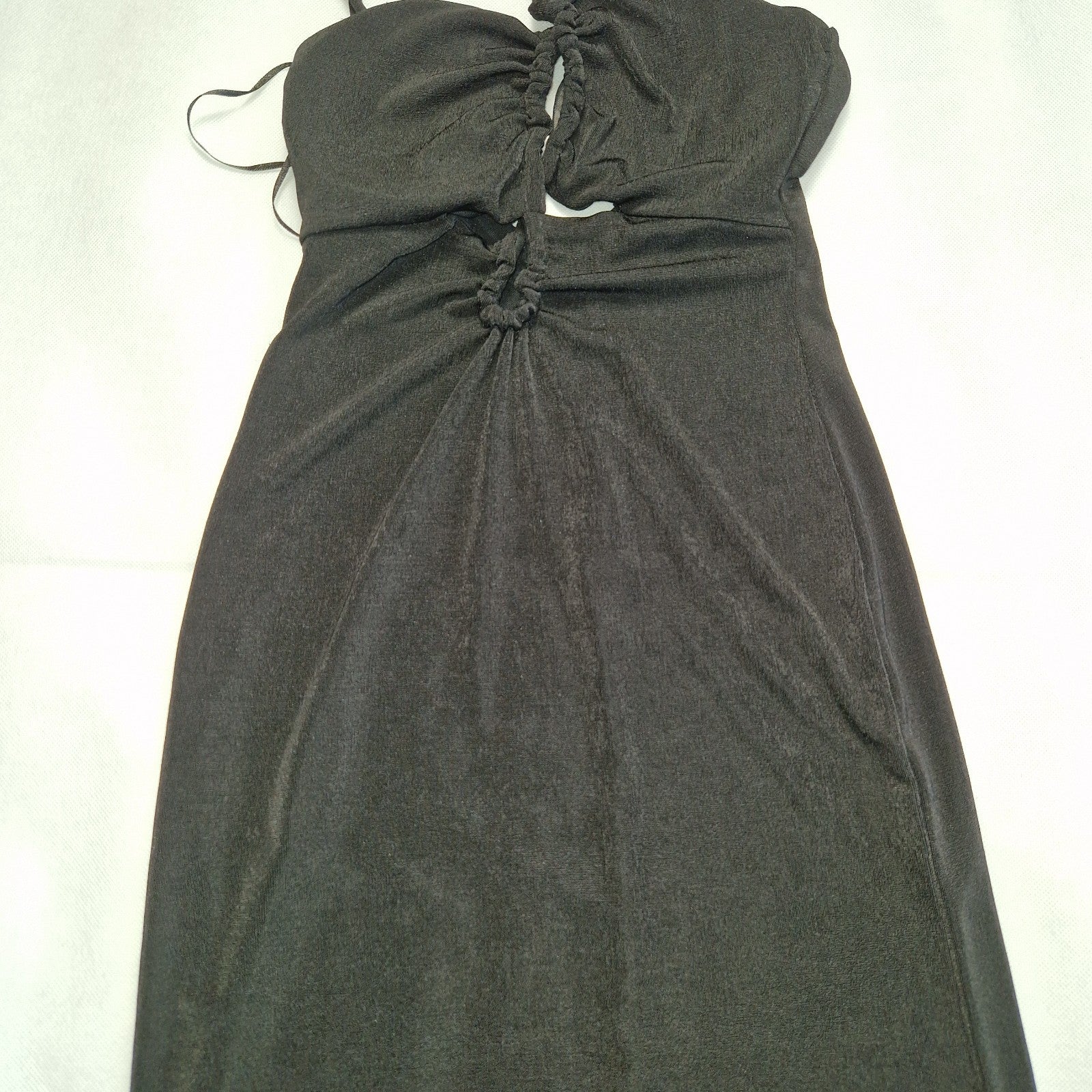 Bershka black off-shoulder crop top with thin straps and a gathered front detail.