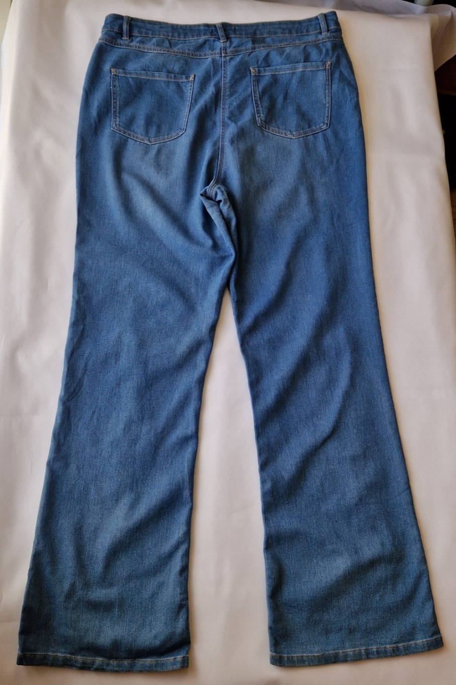 Papaya women's high-rise wide leg jeans in a medium blue wash with a five-pocket design.