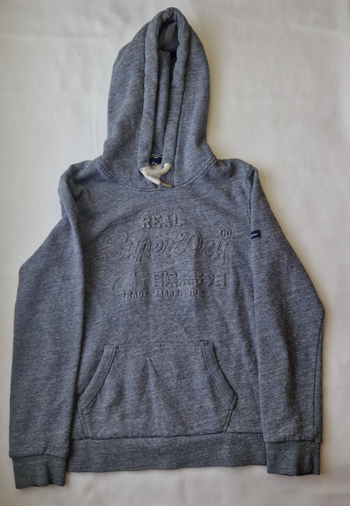 A grey Superdry boys pullover hoodie featuring an embossed logo on the chest.
