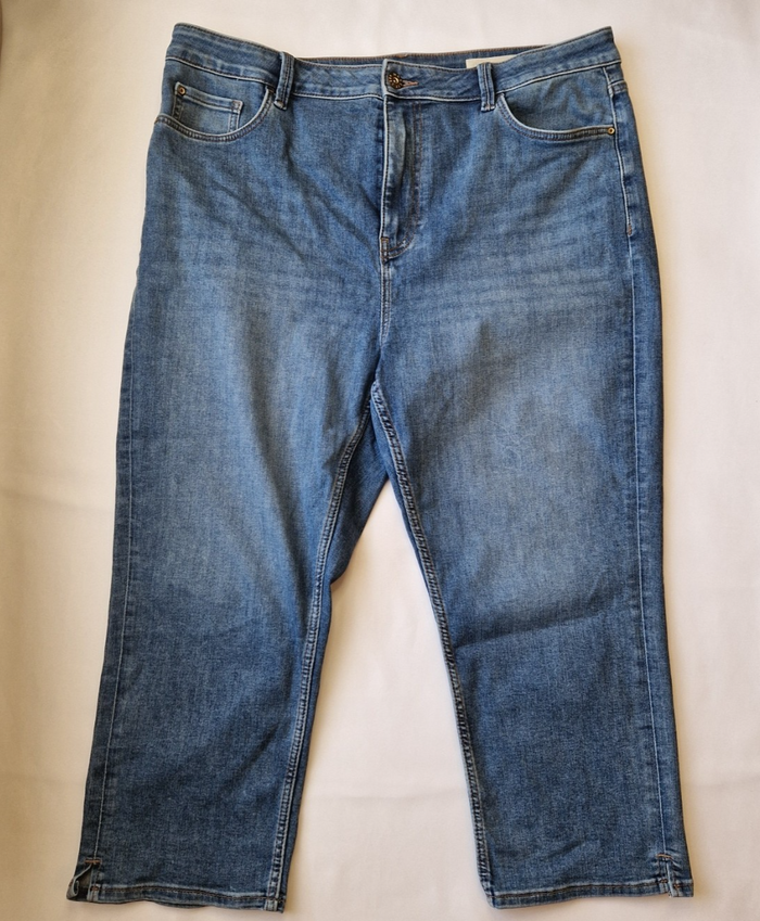 Marks and Spencer mid-rise blue stretch skinny jeans with a five-pocket design.