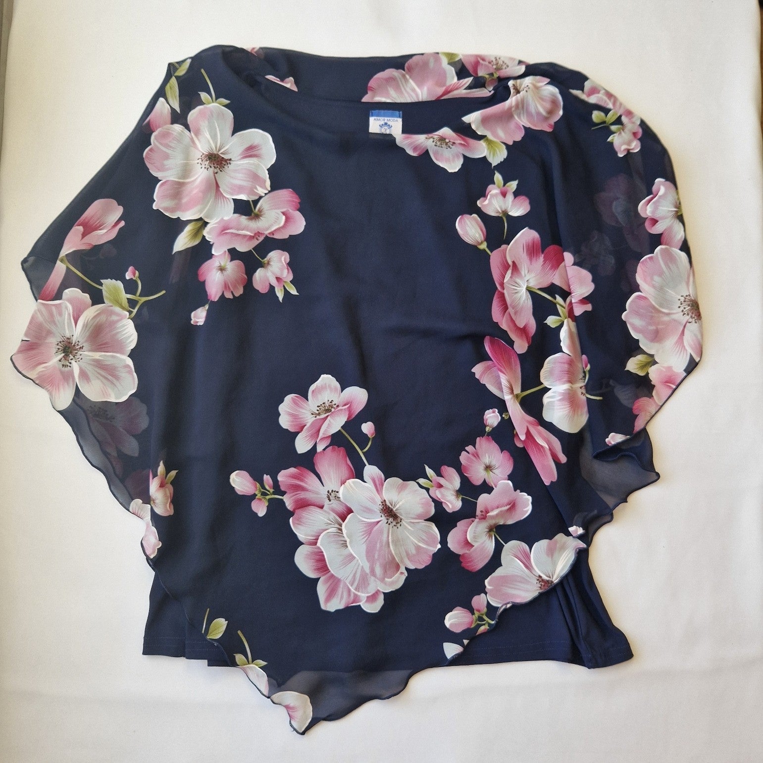 Amor Moda navy chiffon blouse featuring a floral print and a scalloped hem.