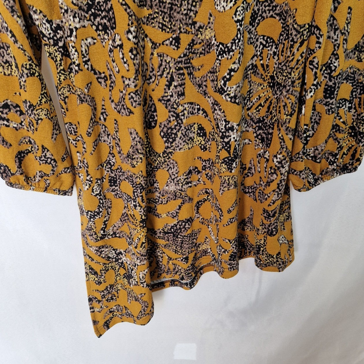 Klass yellow long-sleeve tunic top with an abstract print and an asymmetric hem.
