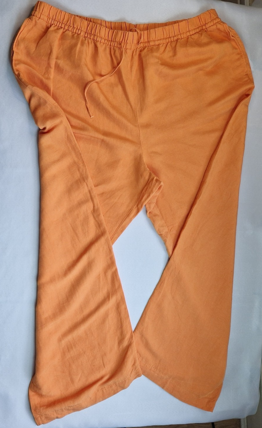 H&M women's orange wide-leg jogger trousers with an elasticated drawstring waist.