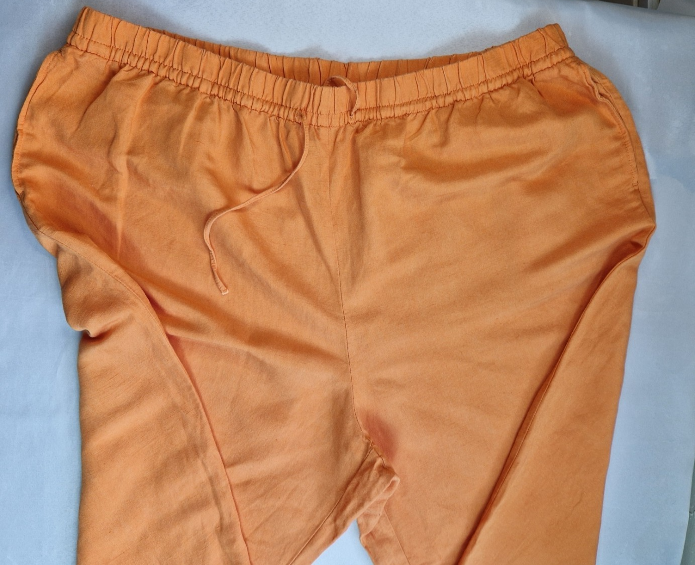 H&M orange wide-leg jogger trousers with an elasticated drawstring waist.