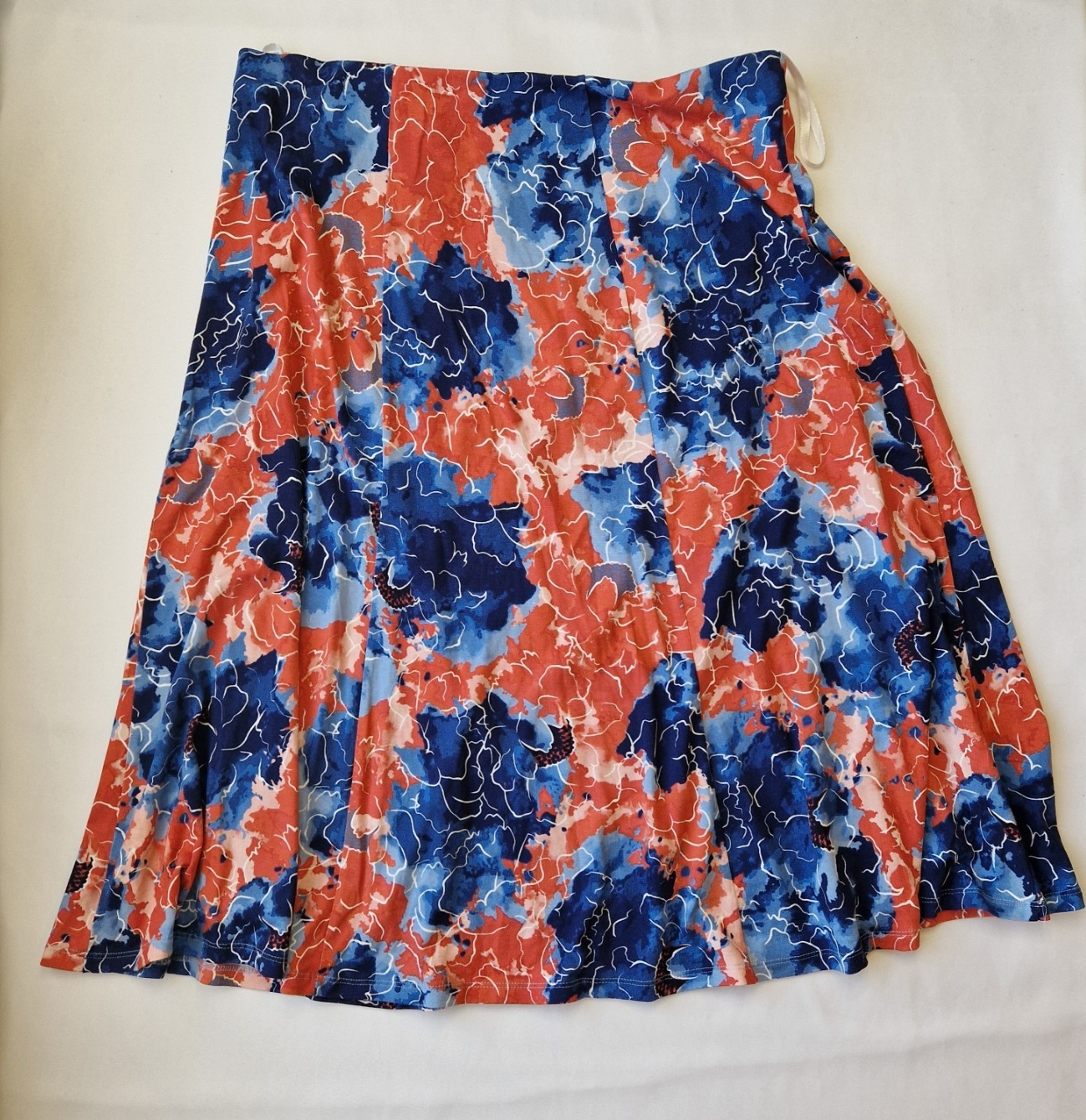 Honor Milburn multicolour floral print midi skirt with an asymmetric hem.