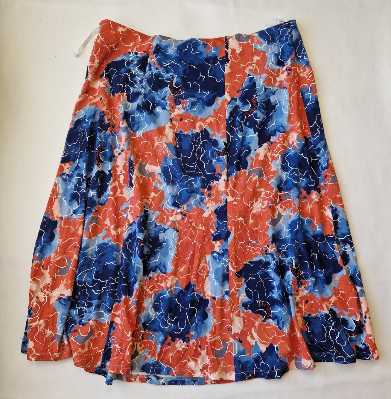 Honor Milburn midi skirt in a multicolour floral print with an asymmetric hem.