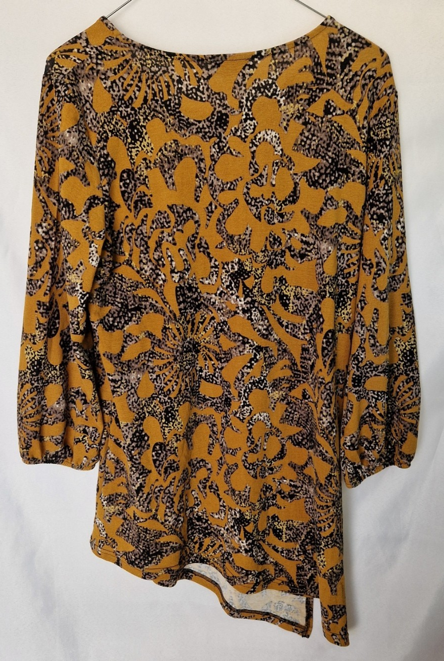 Klass women's yellow long-sleeve tunic top with a black and grey floral print and asymmetric hem.