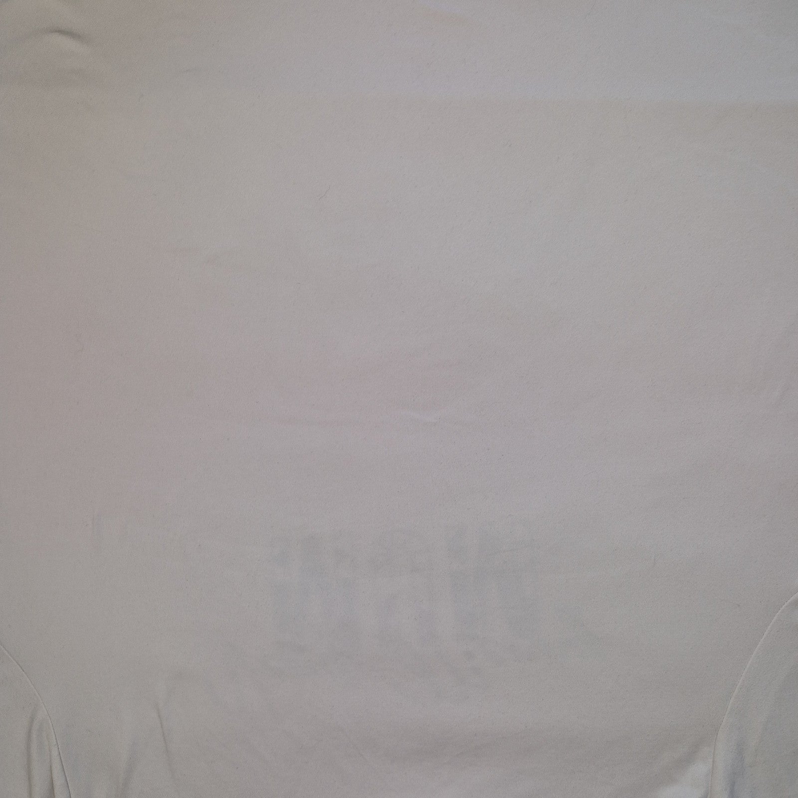 A plain white short-sleeved cotton jersey t-shirt with a round neckline.