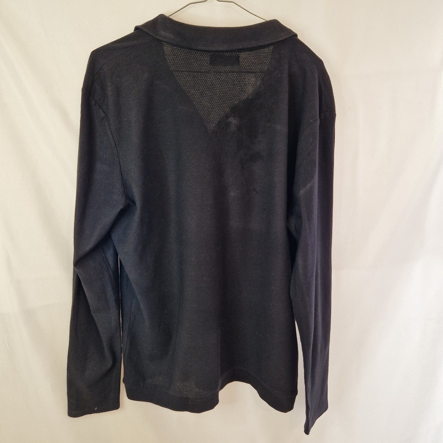 A black Zara Man slim fit cotton knit sweater with a textured mesh panel at the back neckline.