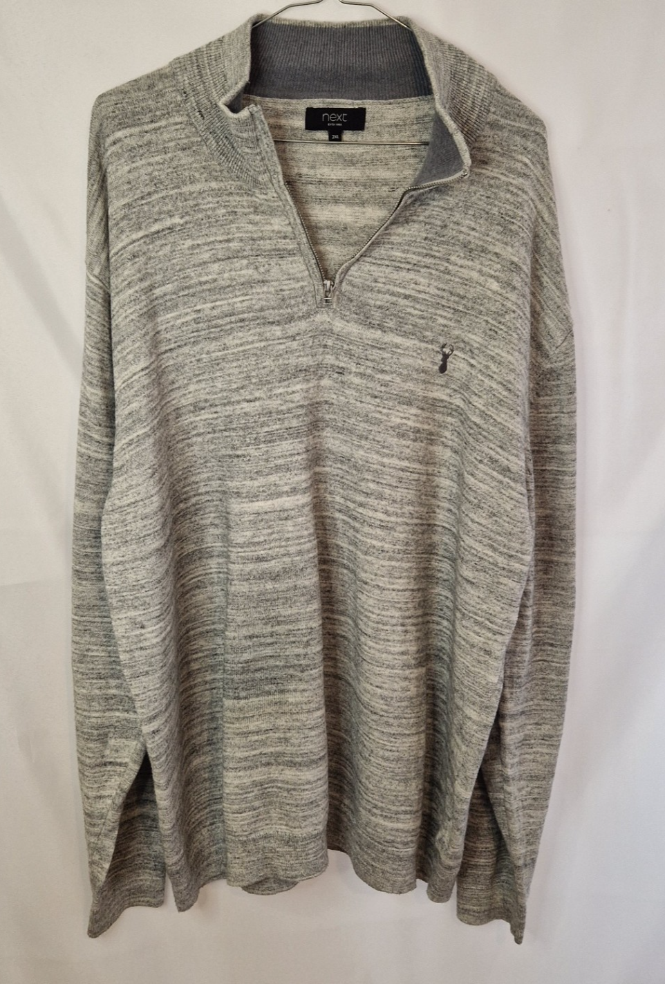 A grey Next quarter-zip knit pullover with long sleeves and a small stag logo on the chest.
