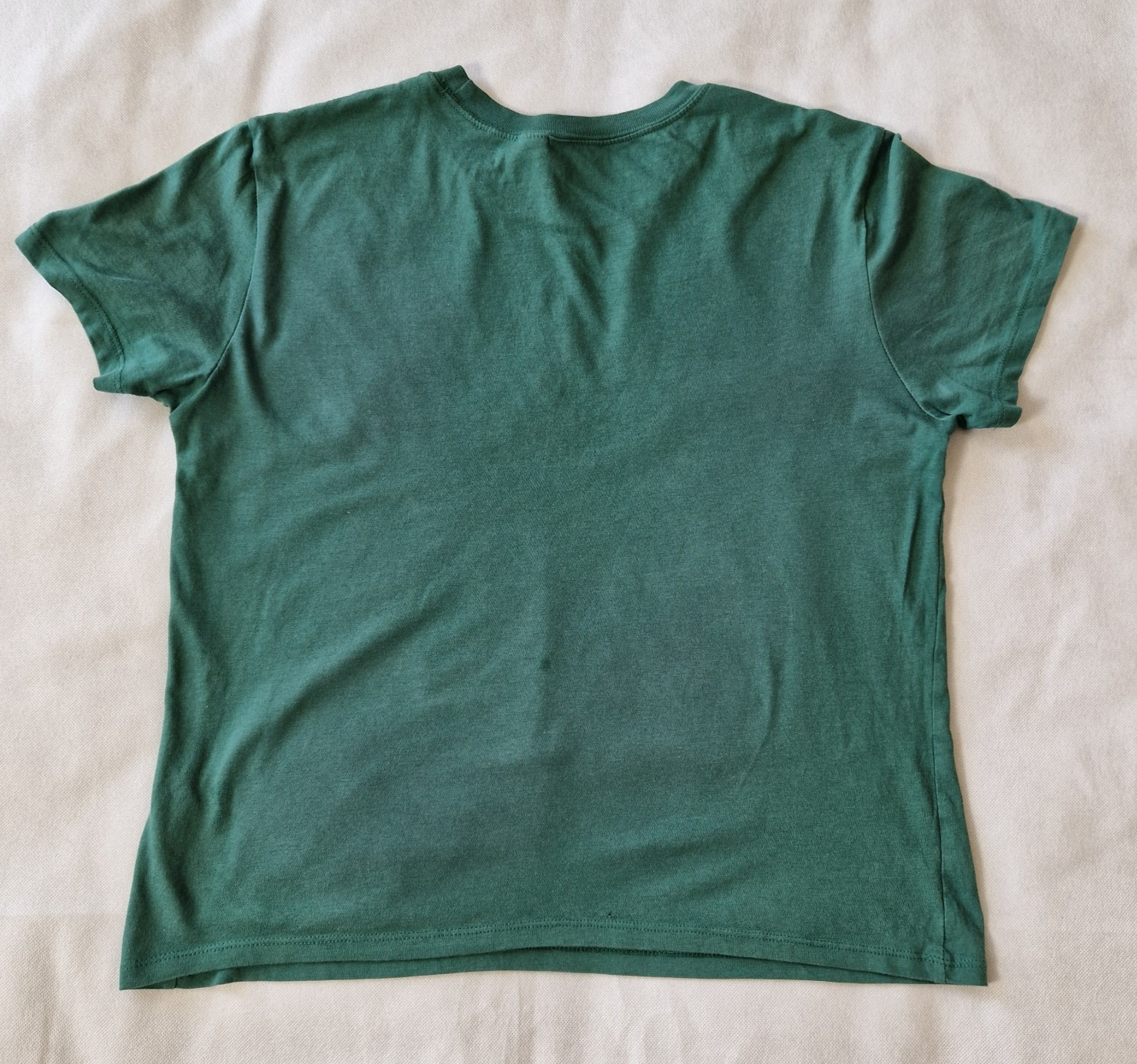 A plain green H&M Divided short-sleeved cotton jersey t-shirt shown from the back.