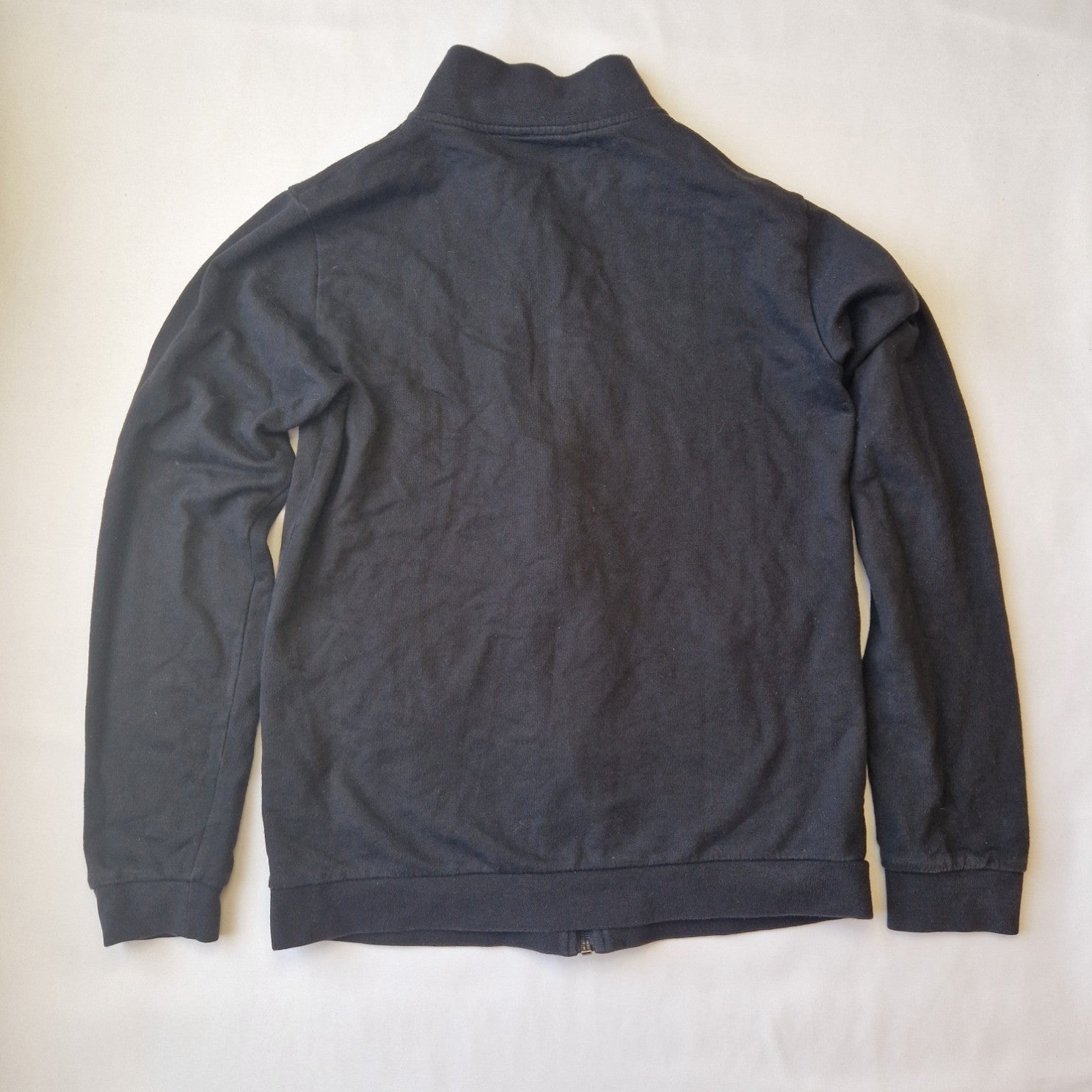 A black EA7 Emporio Armani junior zip-up bomber jacket with a stand-up collar.