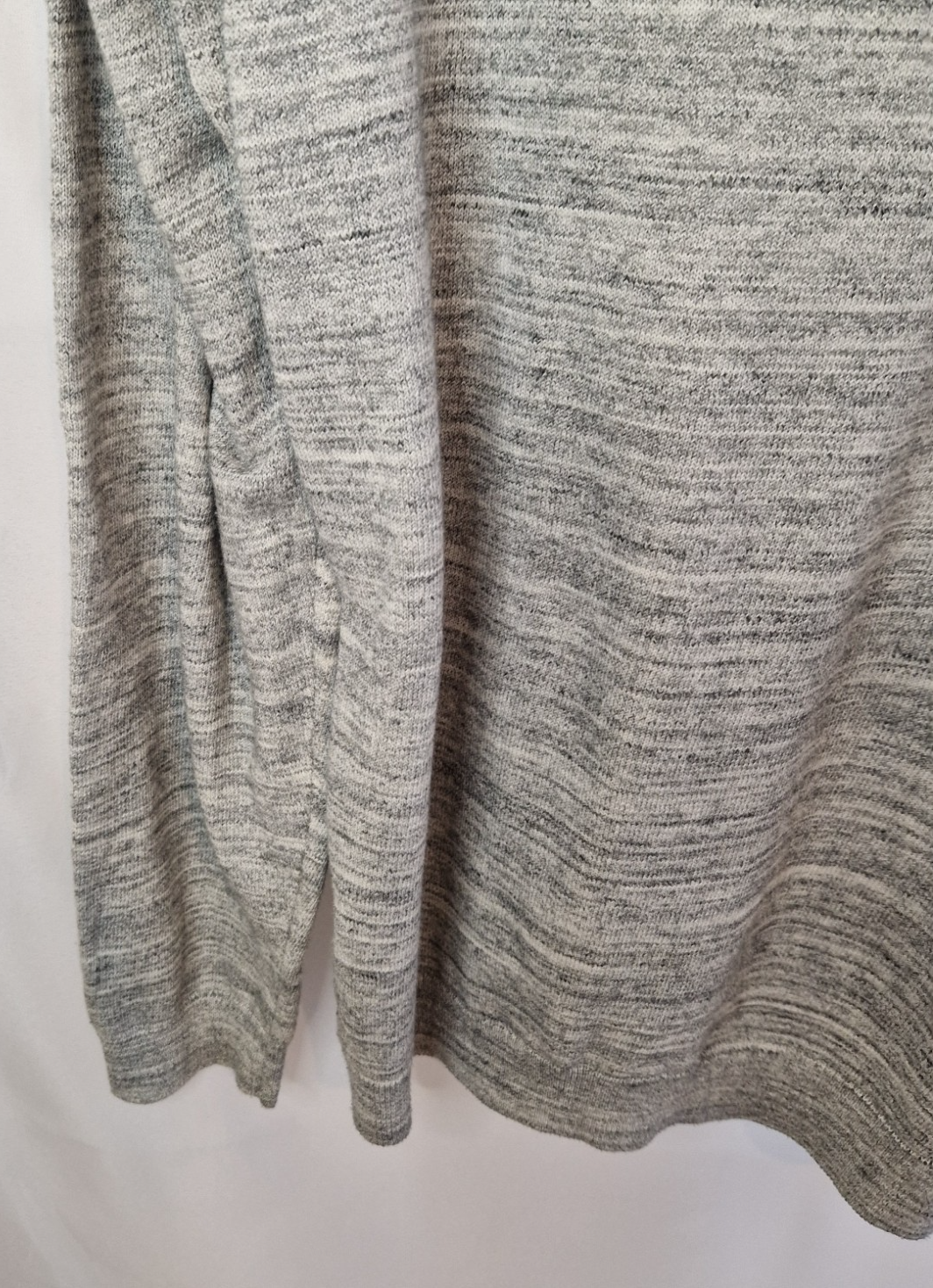 A grey long-sleeve knit pullover with a textured marl finish.