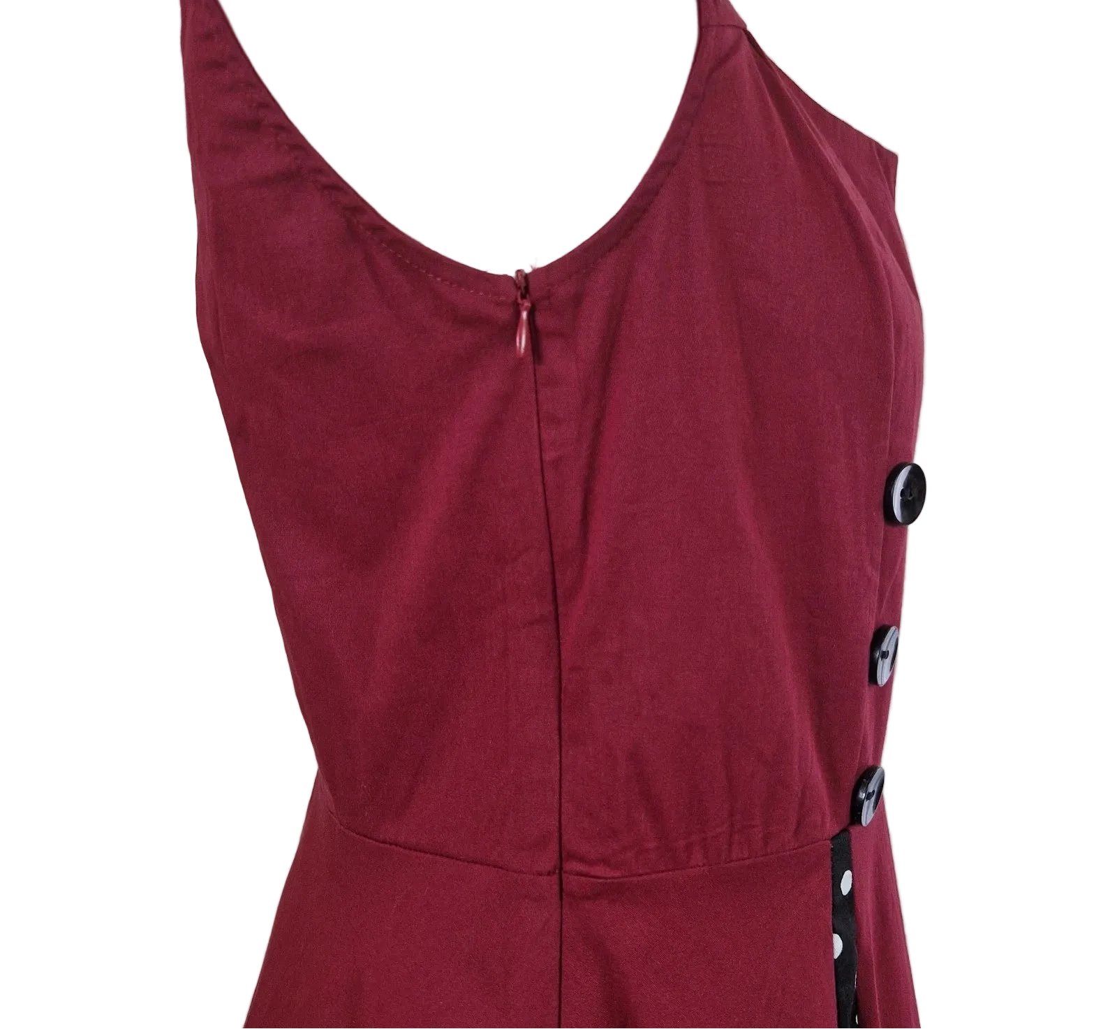A sleeveless red A-line midi dress featuring a side button detail and a back zipper closure.