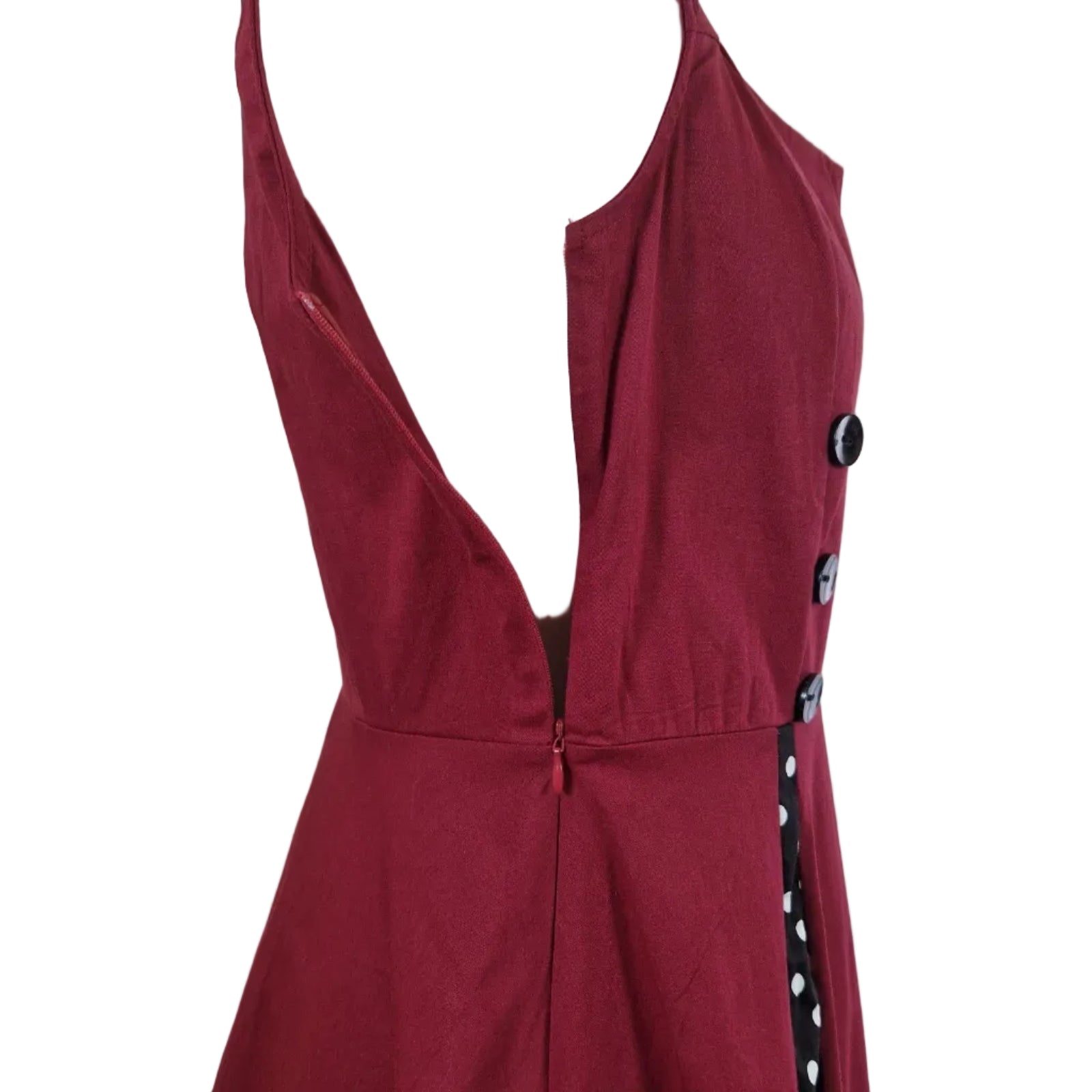 A sleeveless red A-line midi dress with a side zipper and decorative black buttons.
