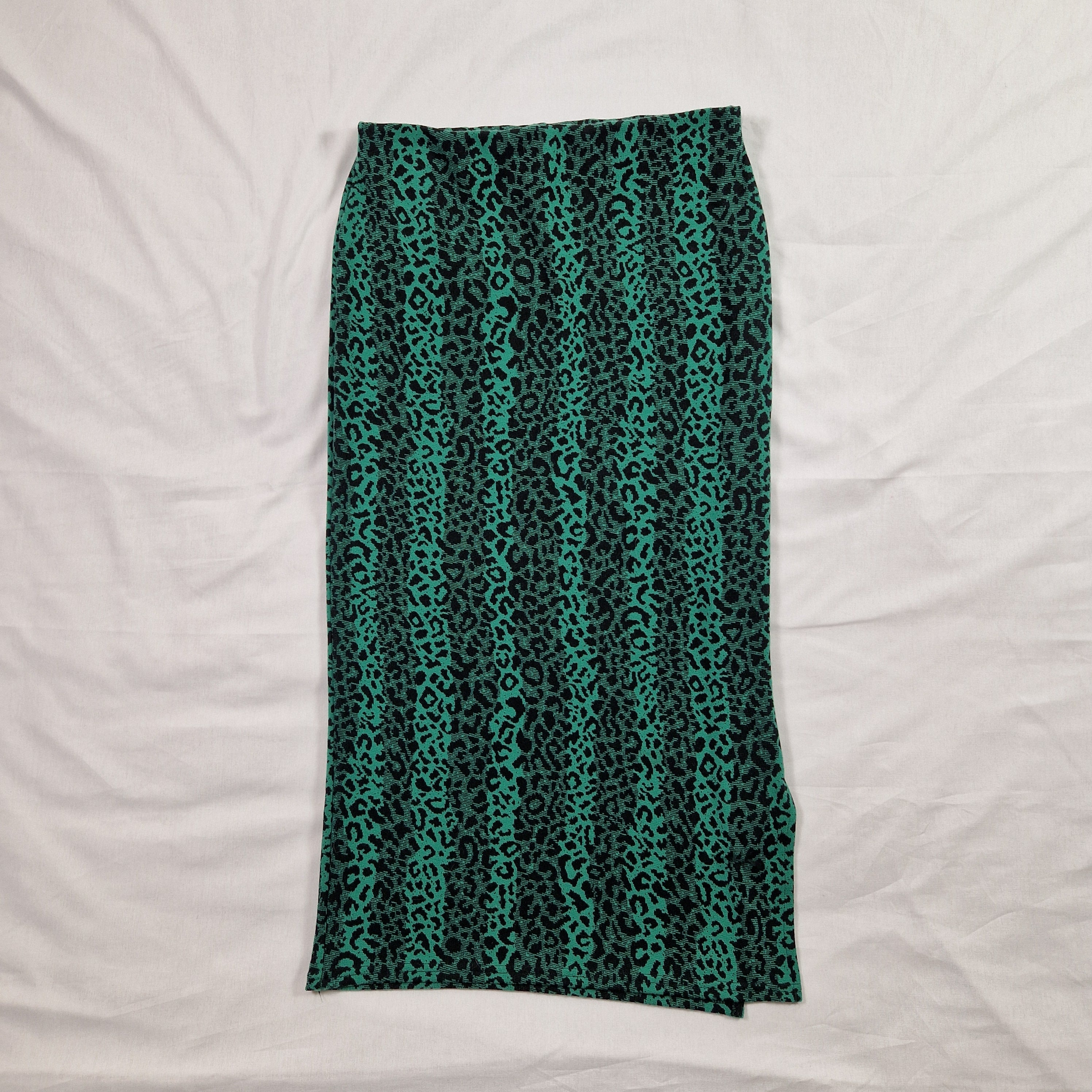 Teal patterned fabric on a white background