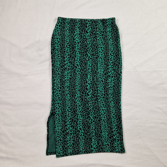 Green patterned fabric on a white background