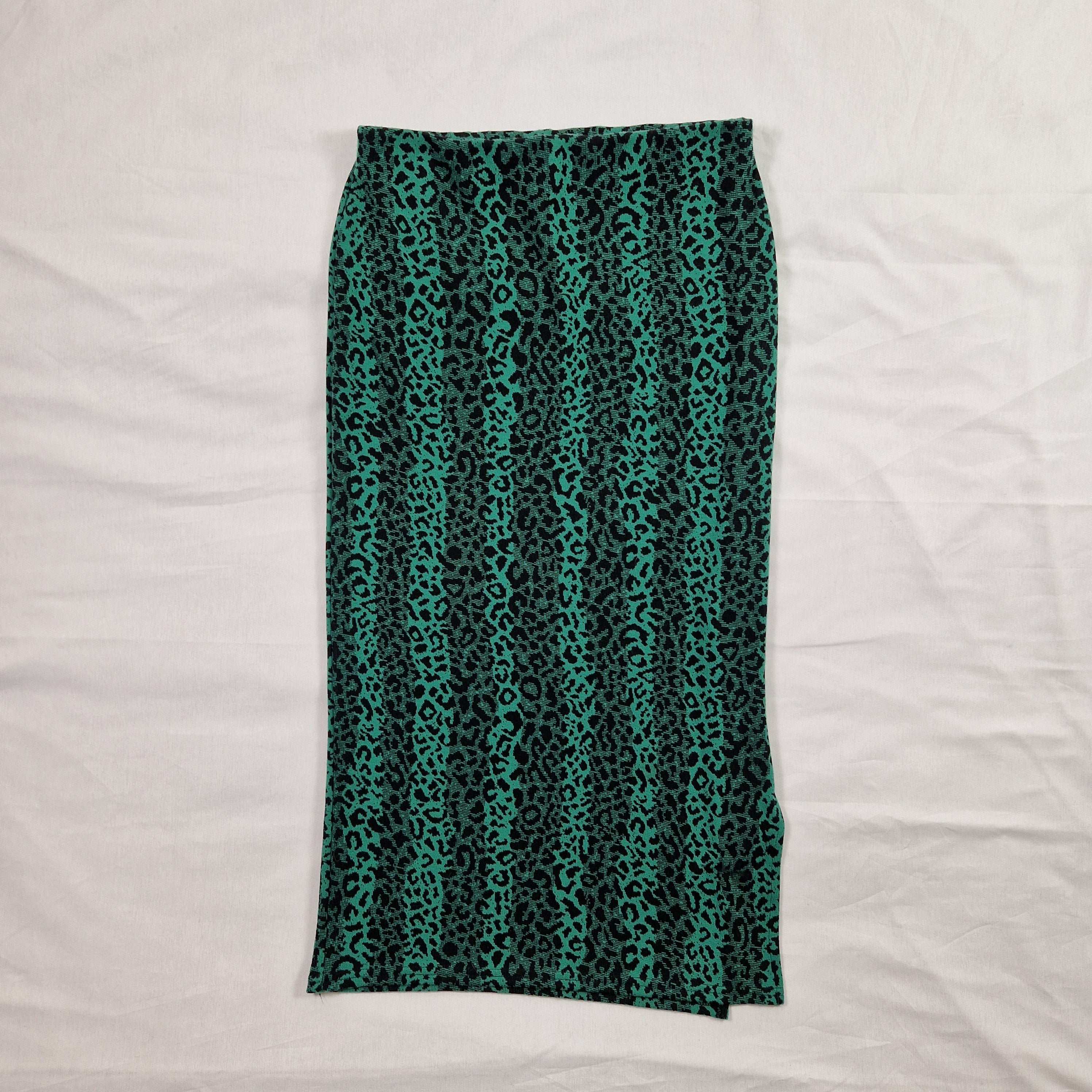 Teal patterned fabric on a white background