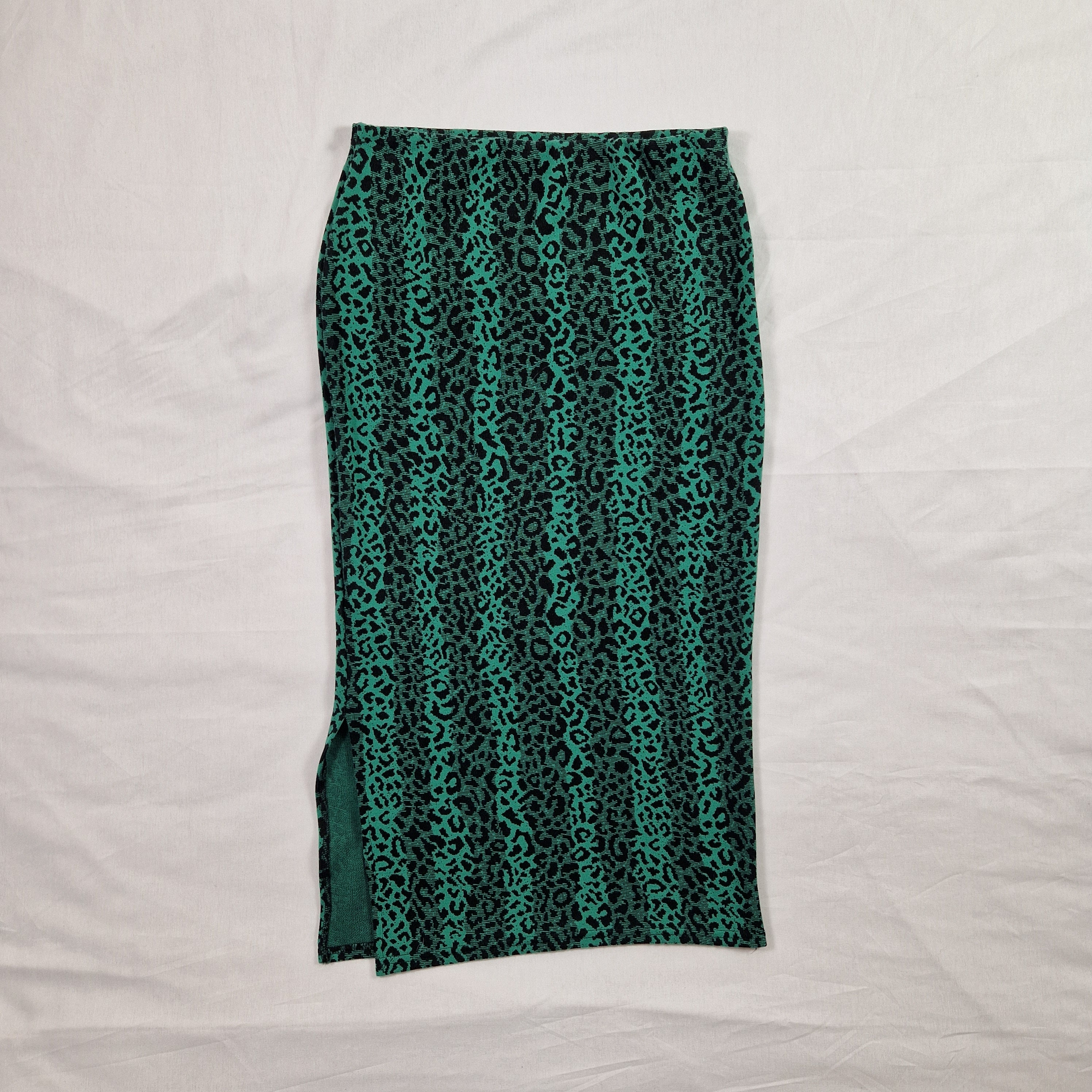 Green patterned fabric on a white background