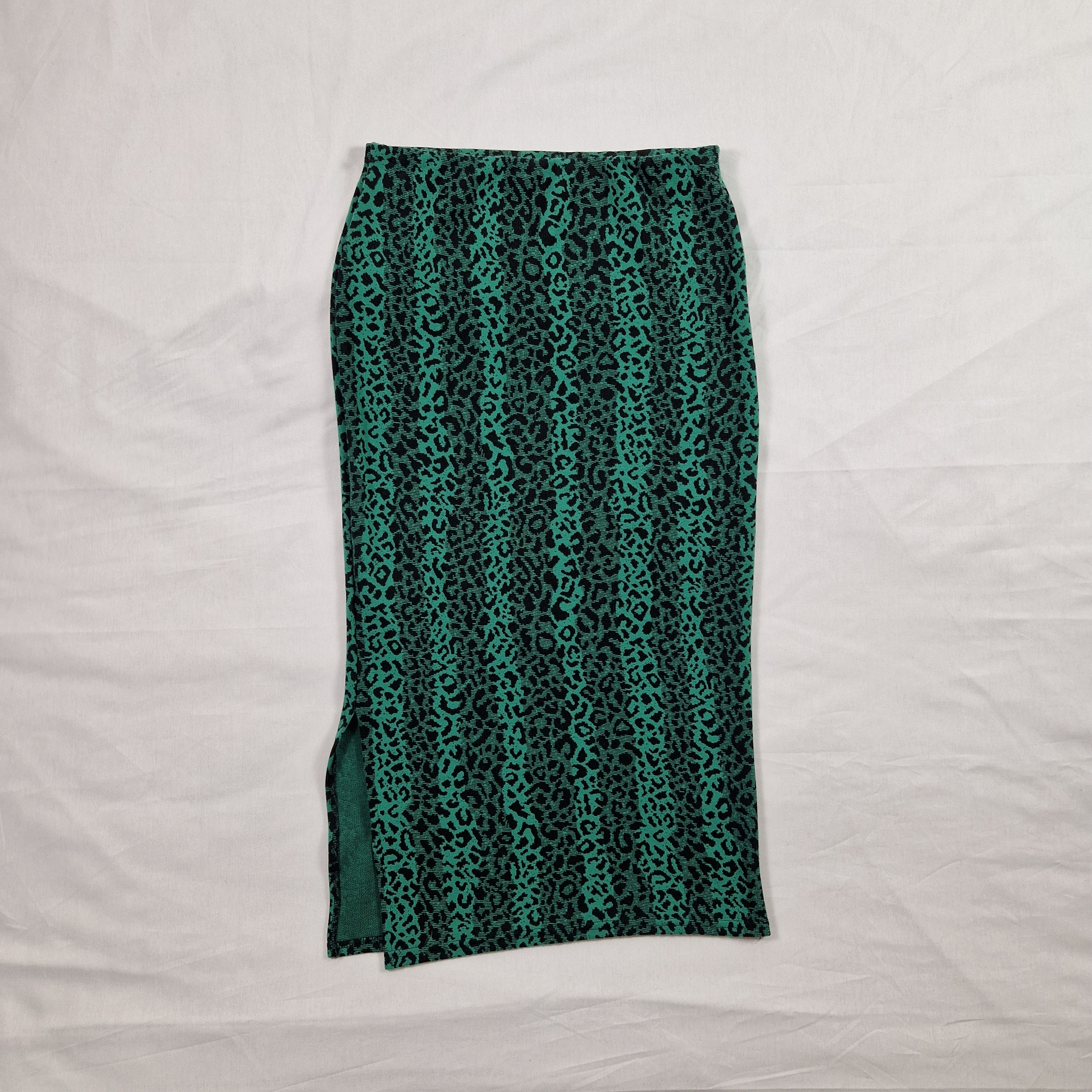 Green patterned fabric on a white background