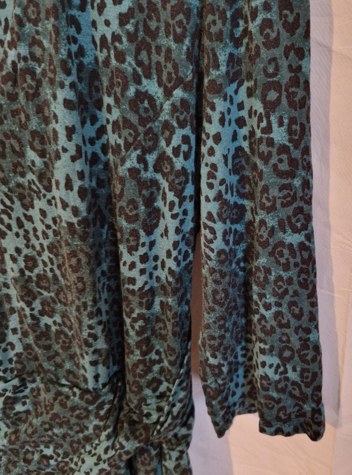 A long-sleeved Jolie Moi maxi dress featuring a teal and black leopard print pattern.