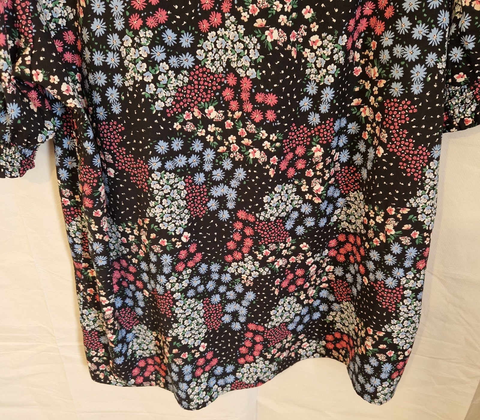 Cotton Traders women's short sleeve blouse in a black floral print.