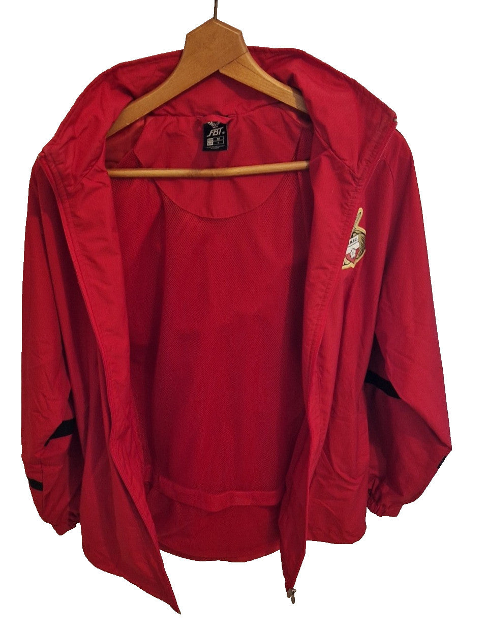 A red FBT Doncaster Rovers football training zip-up jacket with a mesh lining.