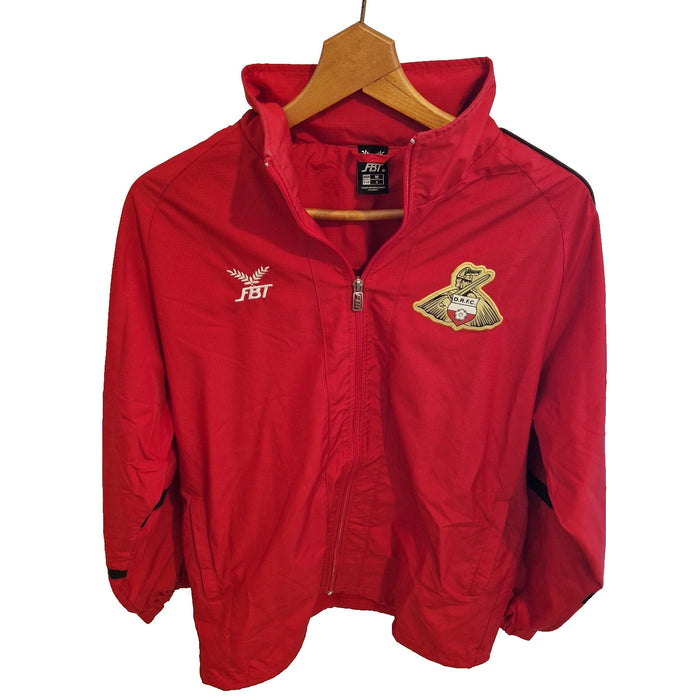 A red FBT Doncaster Rovers football training zip-up jacket hanging on a wooden hanger.