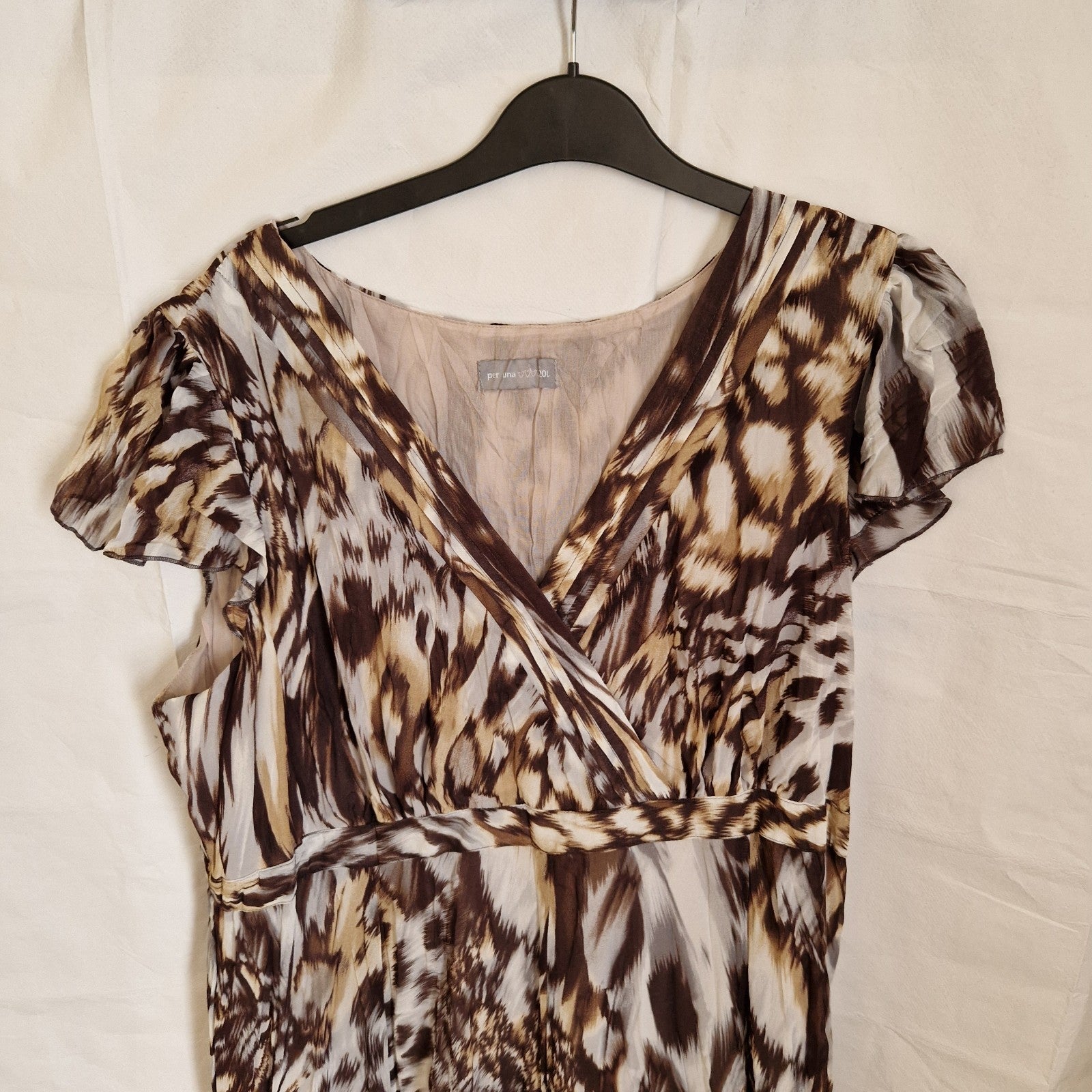 A brown and beige animal print chiffon maxi dress with short ruffled sleeves and a v-neckline.
