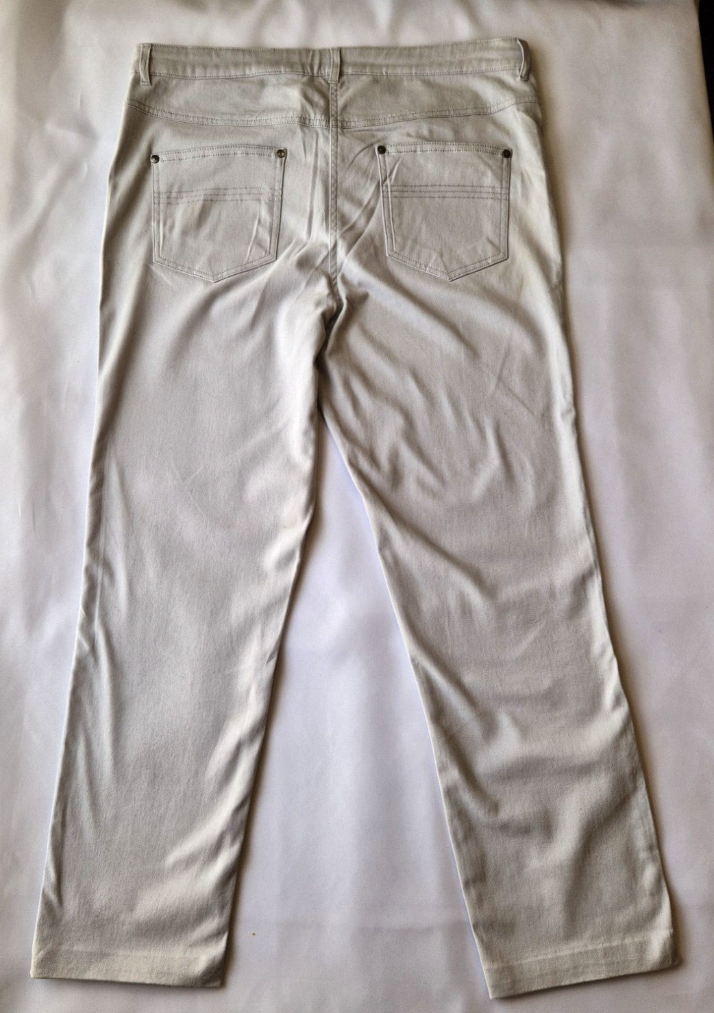 Beige Emreco straight leg corduroy trousers with back pockets and a button closure.