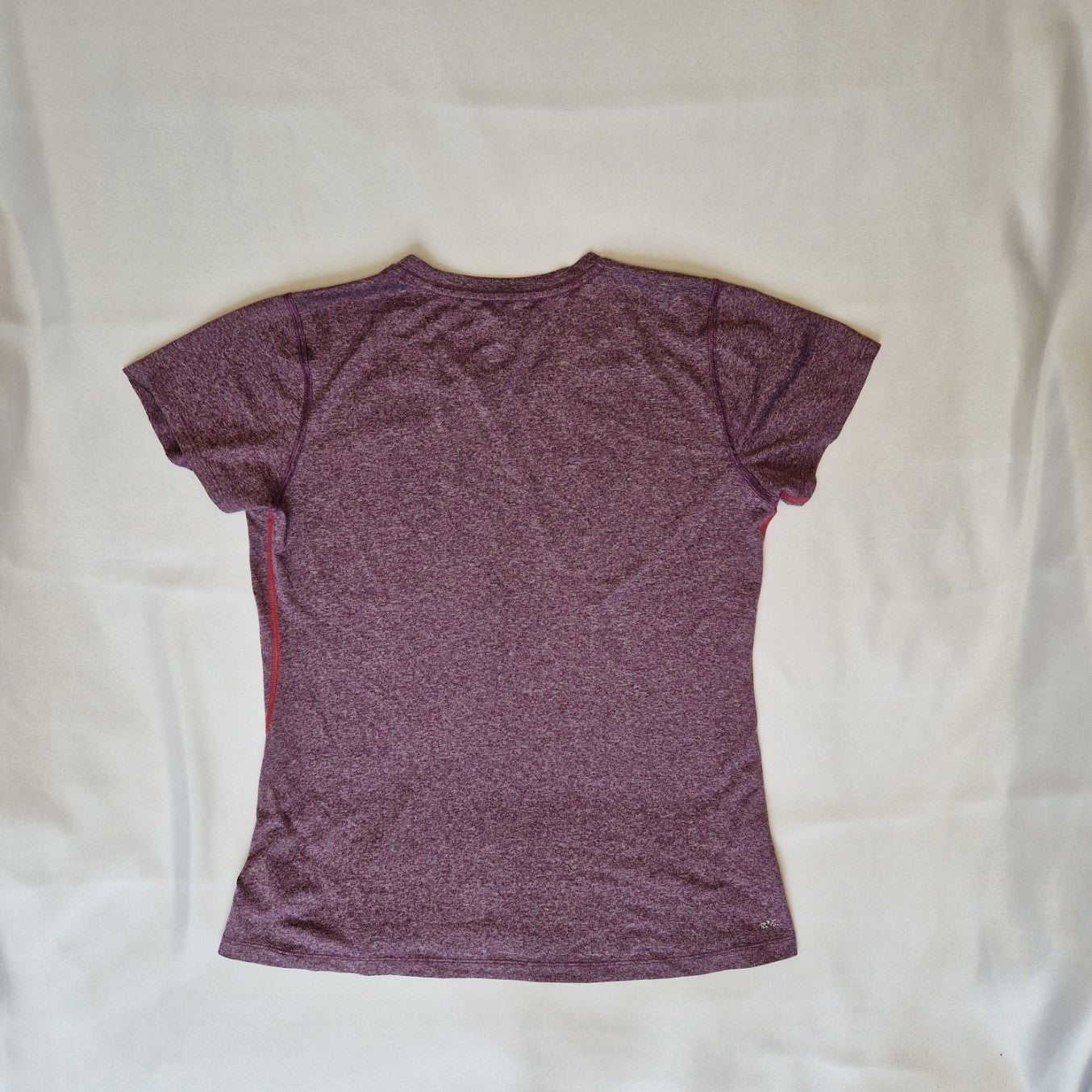 A purple New Balance women's short-sleeved running t-shirt with a round neck.