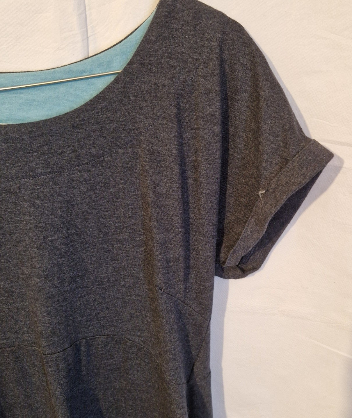 A grey cotton blend midi shift dress with a round neckline and cuffed short sleeves.