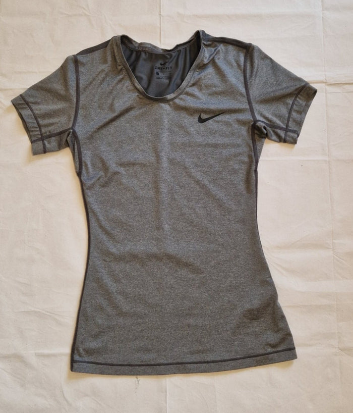 A grey Nike women's slim-fit Dri-FIT crew neck training t-shirt.