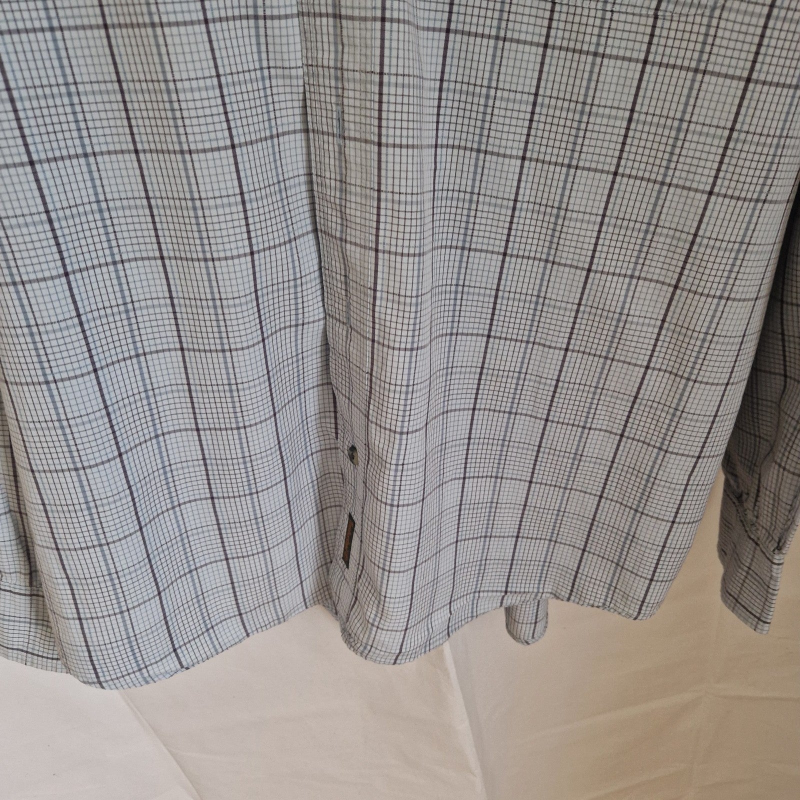 A Timberland long-sleeve shirt in a grey and blue check pattern made from soft cotton.