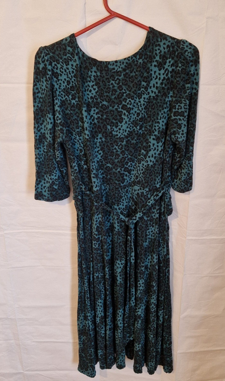 Jolie Moi teal and black leopard print maxi dress with a round neckline and long sleeves.