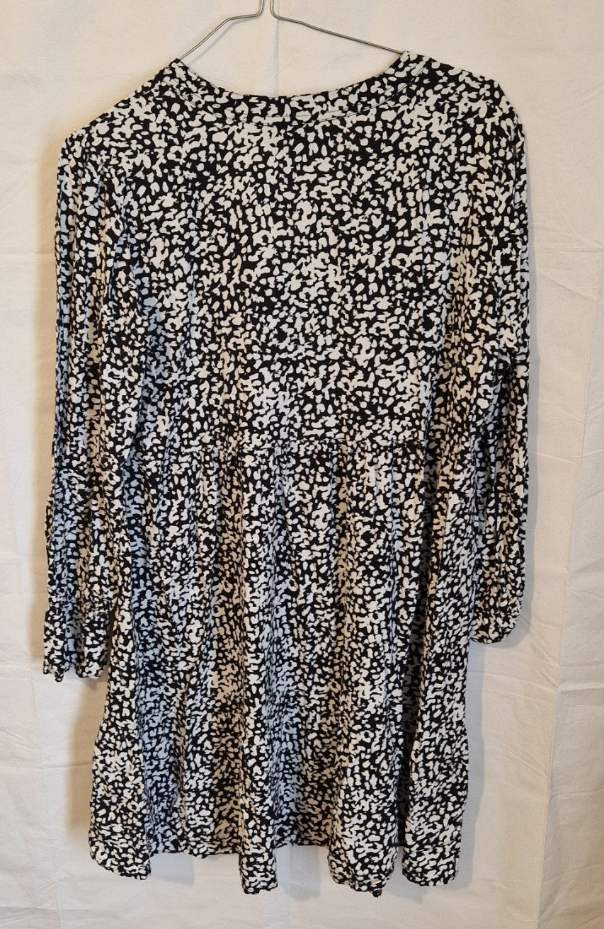 H&M black and white floral print midi dress with a V-neck and long puff sleeves.