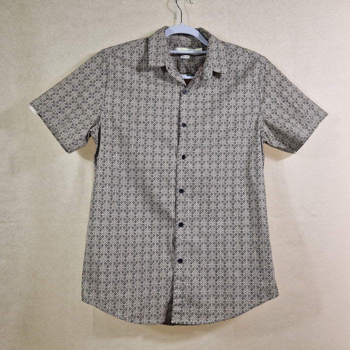 Short-sleeve shirt with a subtle pattern on a beige background