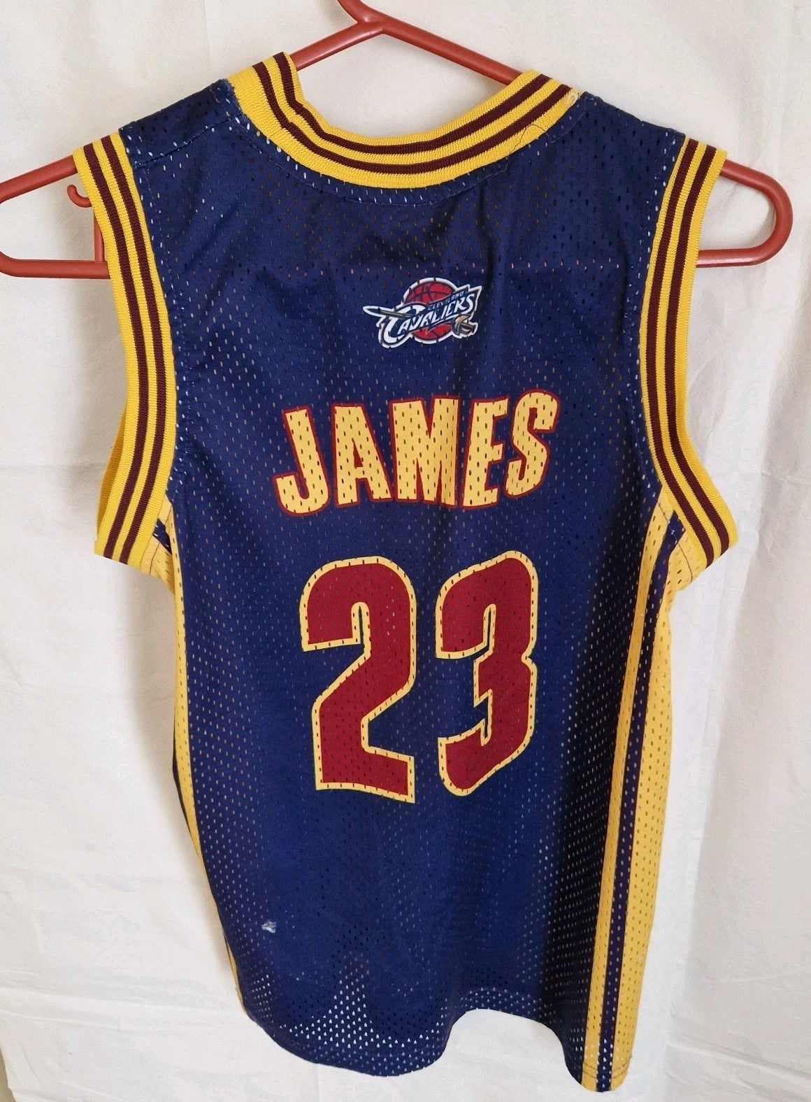A blue Adidas LeBron James Cleveland Cavaliers basketball jersey with number 23 on the back.