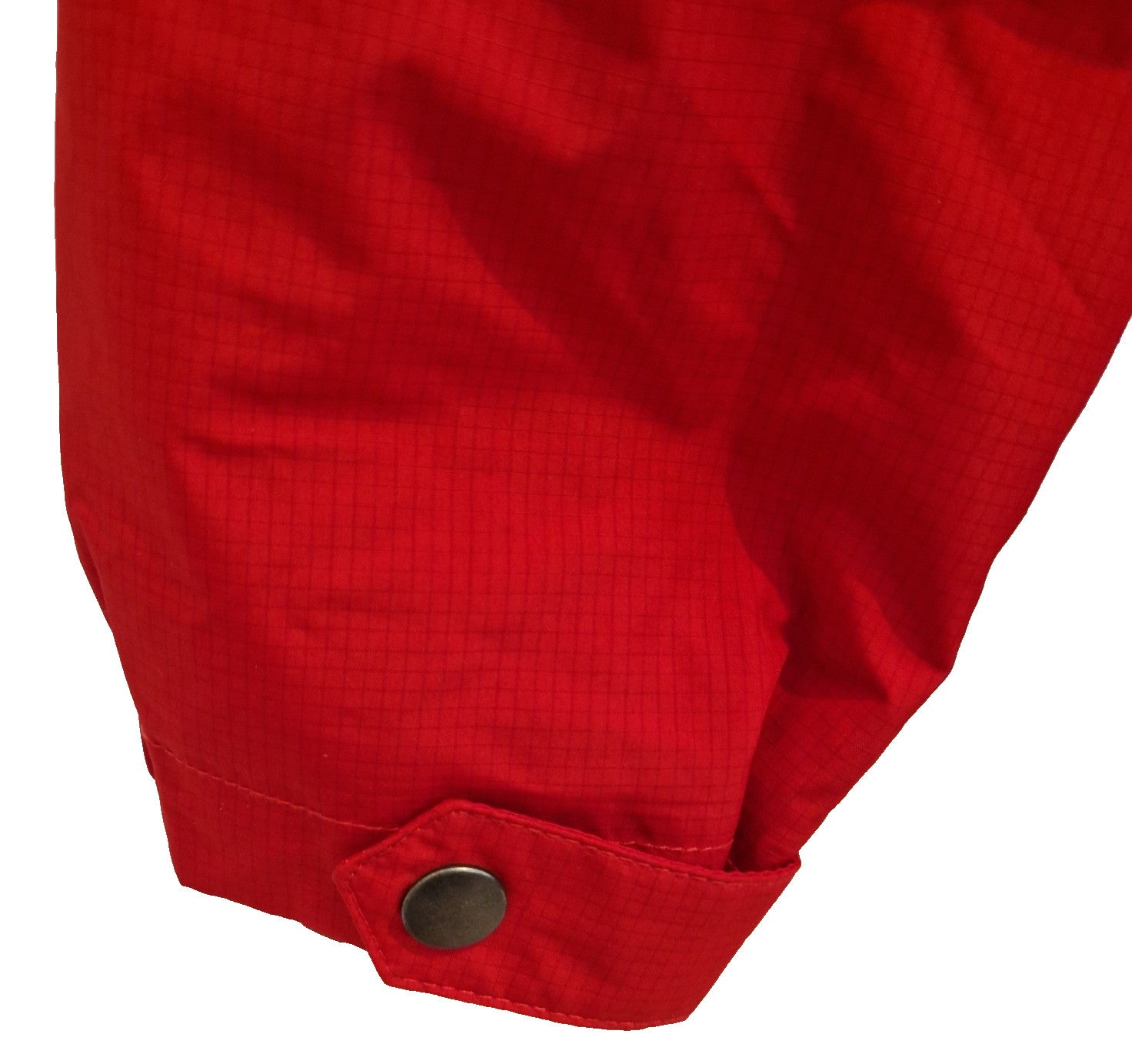 A close-up of the red sleeve cuff on a Doncaster Rovers training jacket with a snap button.