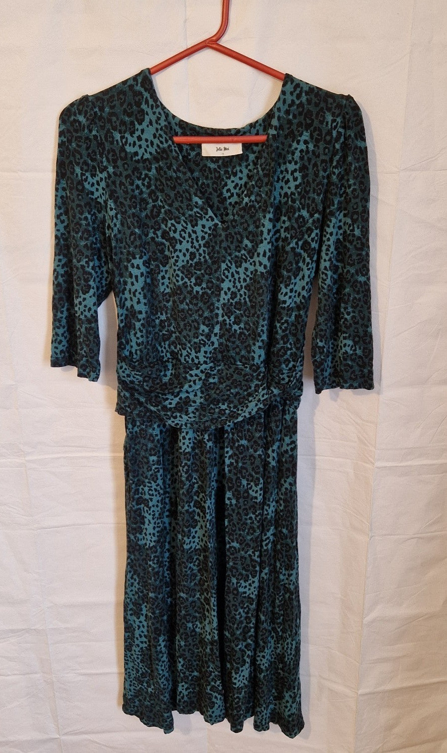 Jolie Moi teal and black leopard print maxi dress with a round neckline and long sleeves.