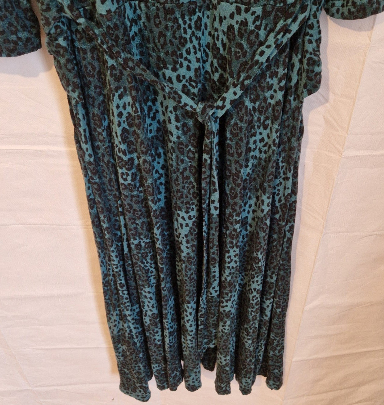 Jolie Moi teal and black leopard print long-sleeve maxi dress with a tie waist.
